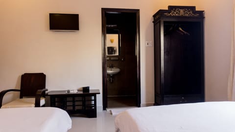 Deluxe Double Room, Multiple Beds, Bathtub, City View | Minibar, in-room safe, desk, blackout drapes