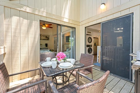 Step outside to your own private patio, a peaceful extension of the home's living space surrounded by mature live oaks and lush Lowcountry landscaping.