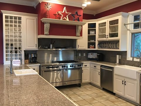 Large commercial gas stove with two ovens. 