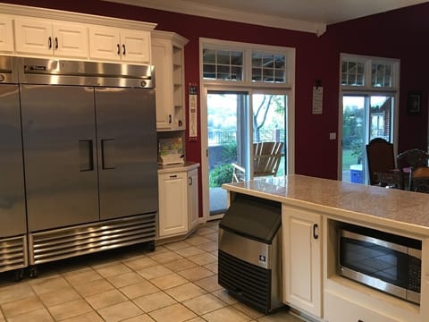 Large commercial refrigerator and freezer. Ice machine and microwave. 