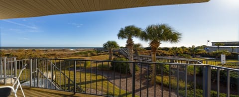 Elevated views and direct boardwalk access nearby keep the beach experience front and center without leaving your rental.