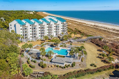 This oceanfront building showcases a well-maintained, resort-style complex with sweeping views and direct access to the shoreline.