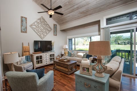 This open, light-filled living space welcomes you with soaring ceilings and a relaxed coastal vibe.