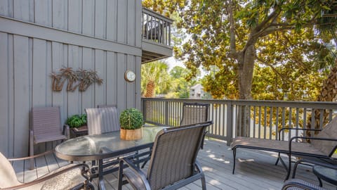 Surrounded by mature trees, it offers a peaceful, shaded setting that feels tucked away while still opening directly to the living space