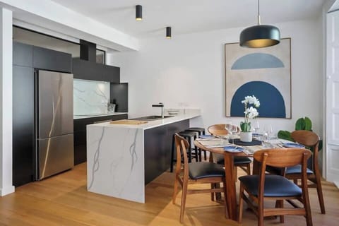 Share meals in the light-filled dining area, where a four-seater table overlooks the street.