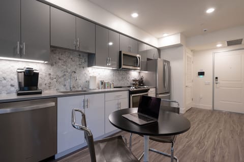 Spacious and efficient Kitchen featuring full-sized stainless steel appliances.
