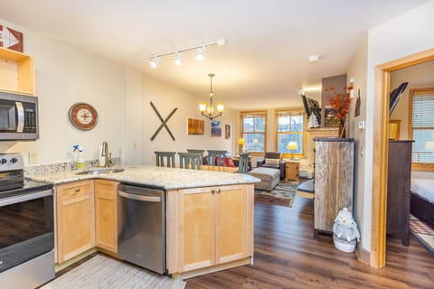 Your fully equipped kitchen flows seamlessly into the cozy living area, perfect for preparing meals while staying connected with family.