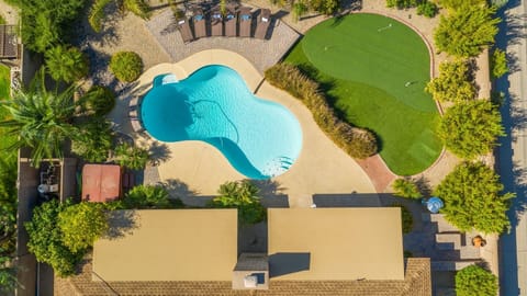 Huge private yard with three hole putting green. / with bean bag toss