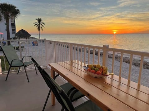 Watch the sunrise on your private patio directly on the beach.