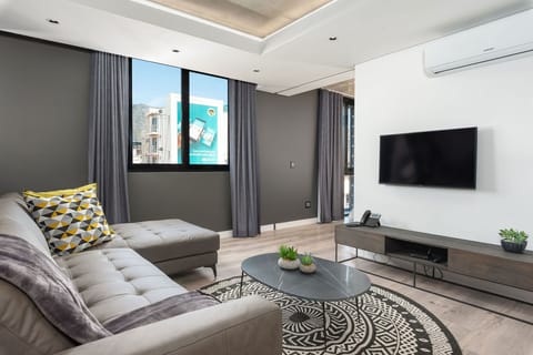 Comfort Apartment | Living room | Flat-screen TV