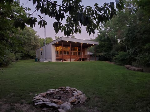 The Palms Get-A-Way back yard with Fire pit.  This view faces the lake.