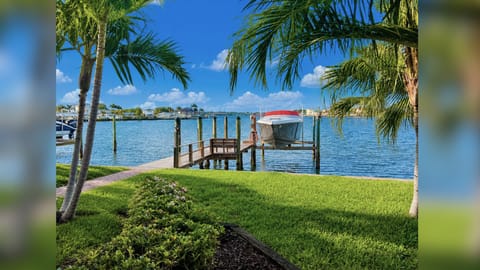 Boat Lift and dock right outside your back door. 