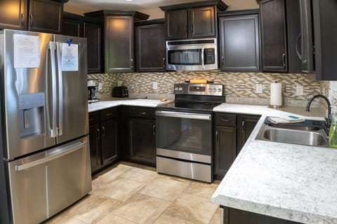 Fully equipped kitchen, a coffee maker upstairs and one downstairs, too.