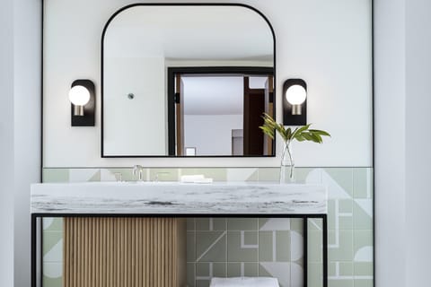 Designer toiletries, hair dryer, bathrobes, slippers