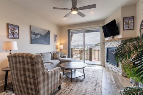 Unwind in your cozy living space with mountain views, a crackling fireplace, and thoughtful touches that make you feel right at home.