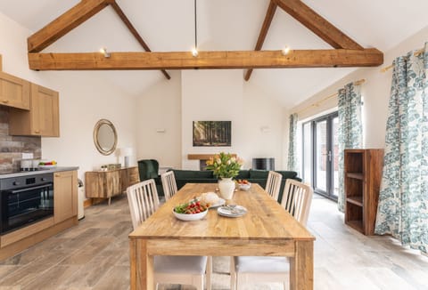 Ground floor: The open-plan living space features high ceilings and exposed beams giving a contemporary and modern feel