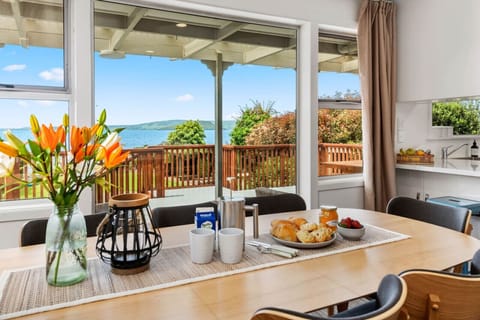Spacious family dining with stunning views - perfect for group stays in Rotorua.