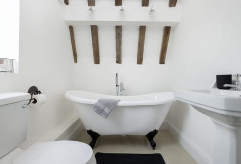 First floor: En-suite bathroom with double ended slipper bath and hand-held shower attachment
