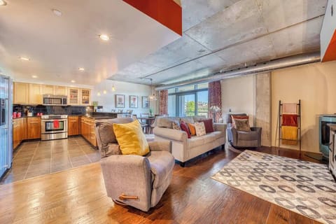 Relax in Style – Cozy up in this chic boho-inspired living room with plush seating and floor-to-ceiling windows.