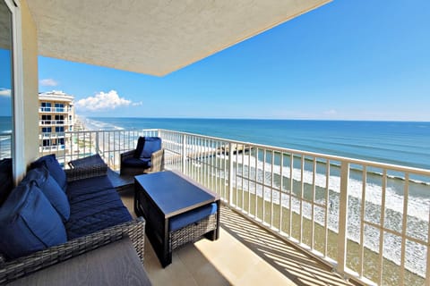 Spectacular Ocean Views from the 11th-Floor Wraparound Balcony with Comfortable Seating & Tables