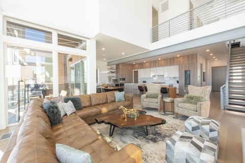 Luxury Townhome | Living area | 55-inch flat-screen TV with cable channels, TV, fireplace