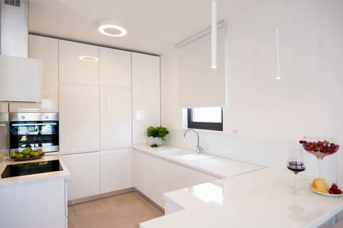 Interior of the modern kitchen on the ground floor of the Croatia luxury villa Trogir 2 for family vacation on Ciovo
