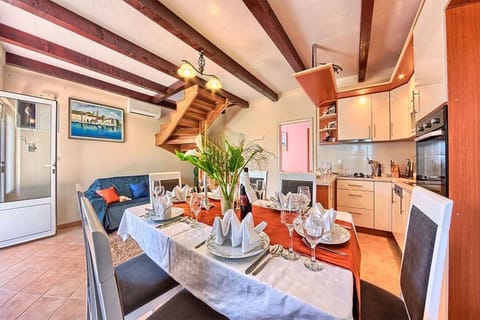 Rich dining table in the fully equipped kitchen of the luxury family vacation villa in Ciovo with concierge service