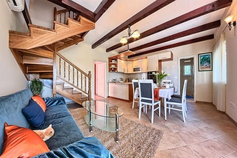 Seating area next to the dining table and kitchen on the ground floor of the villa for luxury  vacation and rent