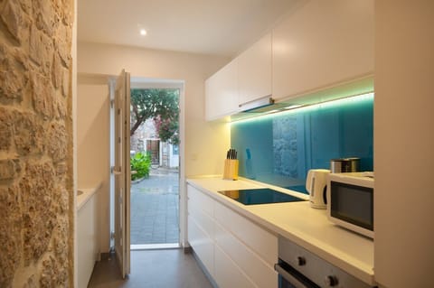 A view of the kitchen and a direct exit to the yard of a luxury holiday villa in the center of Bol