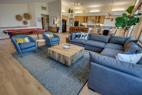 Spacious living room with high end comfortable furniture.