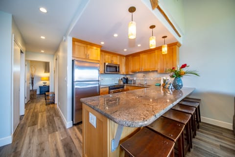 From living room looking towards kitchen, main entry and main floor guest suite.