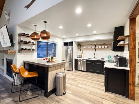 This stylishly designed kitchen features bar seating for 2...