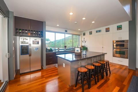 Spacious Modern Kitchen with dining island and breathtaking sunrise views. 