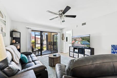 Living room has access to the screen patio space