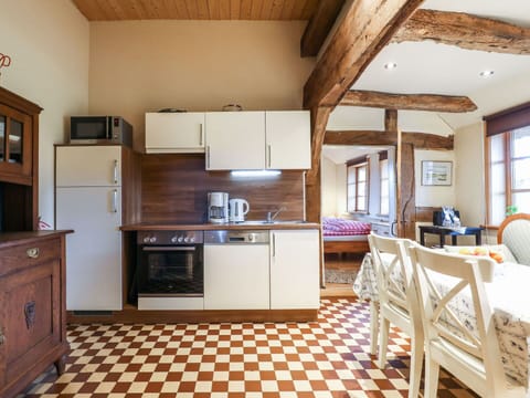 Cabinetry, Countertop, Property, Window, Wood, Kitchen Appliance, Kitchen Stove, Lighting, Kitchen, Interior Design