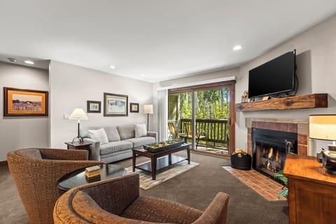 Snow Flower 142 has a cozy gas burning fireplace and TV in the living room.