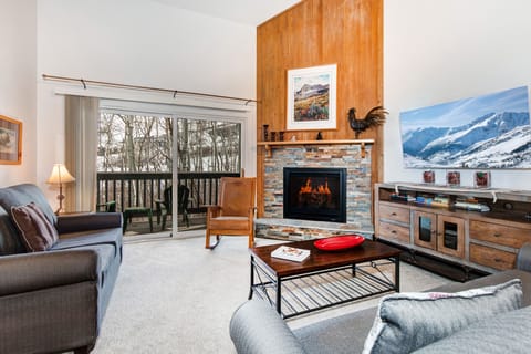Snow Flower 152 offers a living room with 55" flat screen TV and gas burning fireplace.