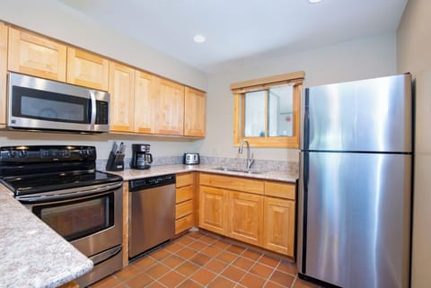 Snow Flower 28 has a well-equipped kitchen with stainless steel appliances.