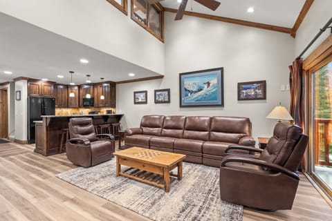 Unwind in your spacious living room with leather seating and soaring ceilings.