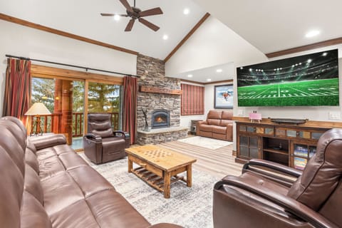 Sink into plush leather seating while your fireplace crackles and watch a show on the TV.