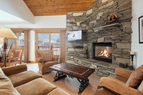 Snow Flower 74 offers a cozy living room with gas burning fire and overlooks Park City Mountain.