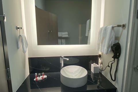 Rainfall showerhead, designer toiletries, hair dryer, towels