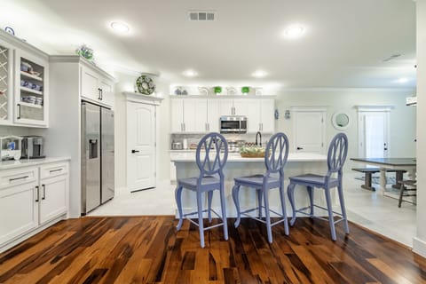 Fully stocked kitchen with pots, pans, and spices. Just provide ingredients!