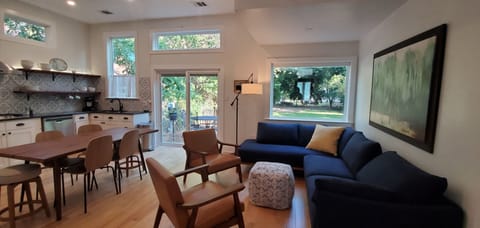 The open living/ kitchen feels light and airy, perfect for visiting.
