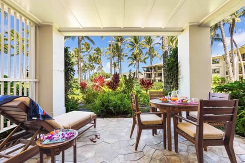 Relax on the tropical lanai with lush garden views at Turtle Bay Villas 108