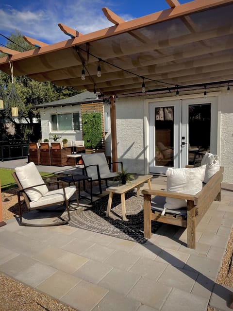 A relaxing outdoor lounge area and a wood burning fire pit. 
