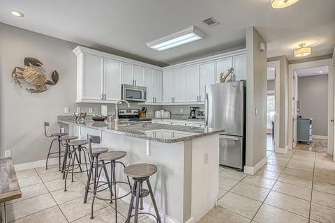 6 counter seating and view to back bedroom space