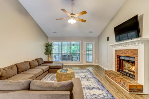 Living room with huge sectional and smart TV 