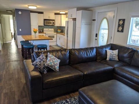 A view of the hallway leading to the main bedroom and washer and dryer