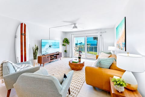 Stylish living room with modern decor, plush seating, and breathtaking ocean views